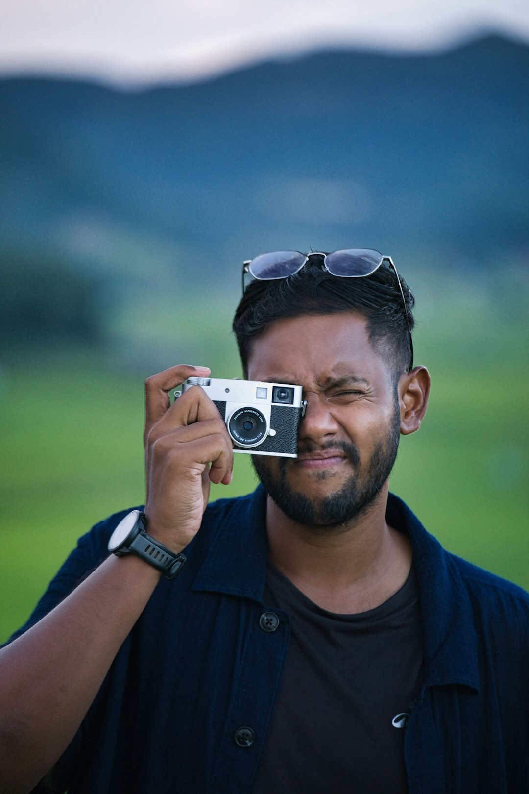 Portrait of Danish male founder holding a camera